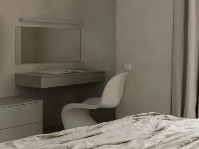A minimalist bedroom with a bed, chair, desk, and mirror against a textured gray wall.