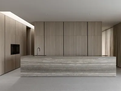 Modern kitchen with marble countertops and integrated appliances