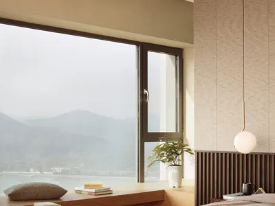 Modern minimalist bedroom featuring wood, glass, and fabric materials and textures.