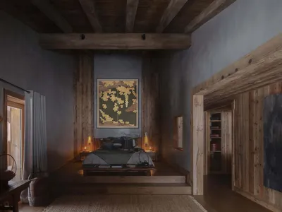 A minimalist bedroom with dark walls, wooden floors, and a botanical painting hanging above the bed.