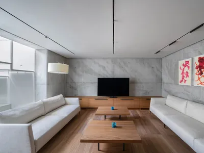 Industrial-style living room featuring concrete and wood materials.