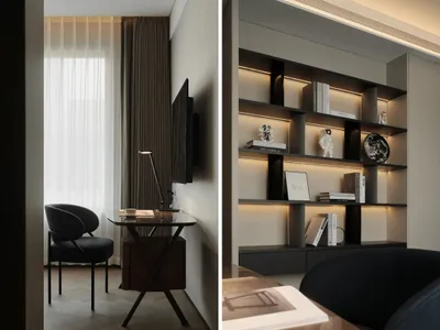 A modern home office featuring black furniture and minimalist design elements.