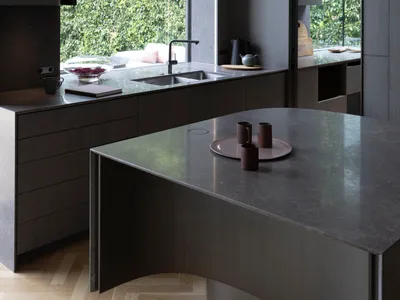 A sleek, minimalist kitchen featuring modern stone interior design.