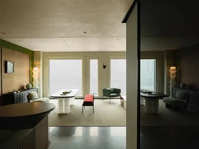 Modern, industrial-style living room with metallic finishes and minimalist decor.