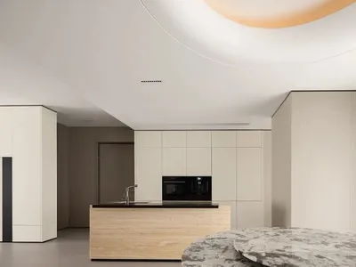 Modern kitchen featuring a wooden countertop and concrete flooring