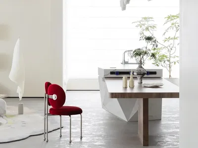 Modern kitchen interior with marble countertop and white appliances.
