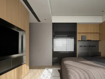 Minimalist bedroom featuring a large bed with wooden elements and a wooden floor, illuminated by natural light from a window.
