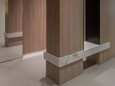 Modern industrial interior with wooden paneling and marble counter