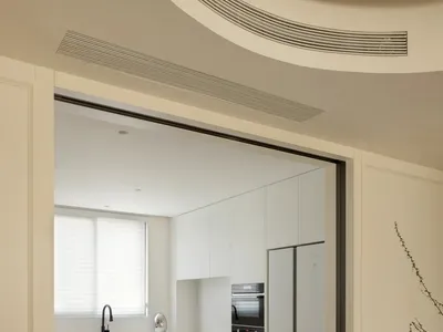 Modern kitchen with minimalist design and sleek, contemporary materials like marble and stainless steel.