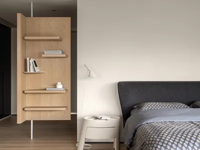 Modern minimalist bedroom featuring wood furniture, fabric bedding, and metal accents.