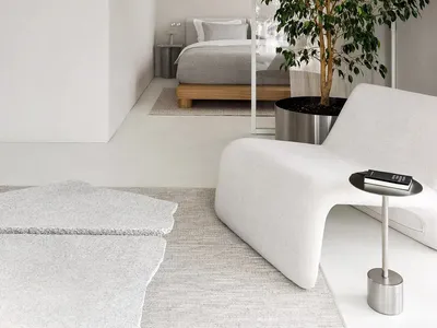 Minimalist bedroom with metal, glass, and wood elements