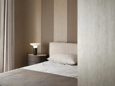 A modern, minimalist bedroom featuring textured materials and a cozy ambiance.