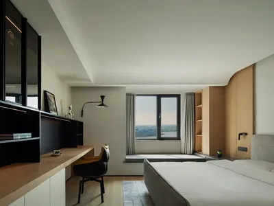 A minimalist bedroom featuring wood and glass elements.
