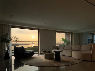 Minimalist living room featuring marble furniture and floor-to-ceiling windows with a scenic view.