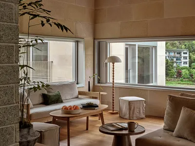 Industrial-style living room featuring timber furnishings and a minimalist design.