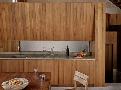 Modern kitchen featuring wooden cabinets and countertops, with a focus on the clean lines and natural wood textures.