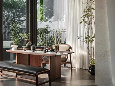 Modern living room featuring a Scandi-inspired design with wooden furniture and minimalist decor.