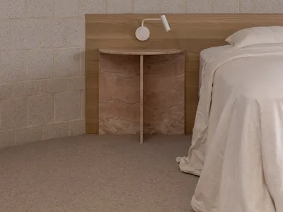 A minimalist bedroom with a wooden headboard and white bedding.
