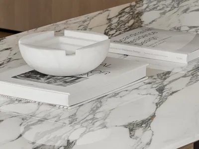 A minimalist kitchen interior design featuring a marble counter top.