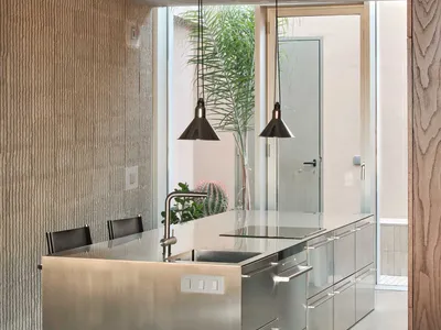 A modern kitchen with metallic features.