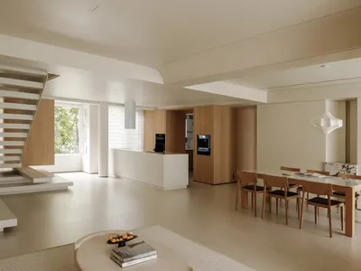 現代廚房與餐廳區域，搭配白色與木質家具，極簡設計。
