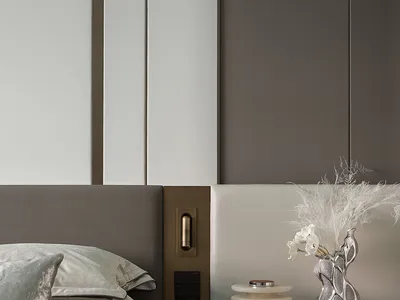 Modern bedroom featuring stylish decorative storage units