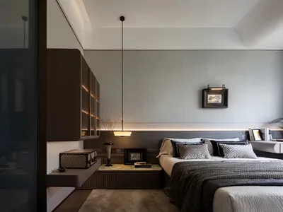 A modern bedroom featuring a bed with floating nightstands and a headboard with built-in lighting, set against a textured lig