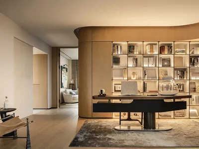 A modern home office featuring a wooden wall panel with built-in lighting.