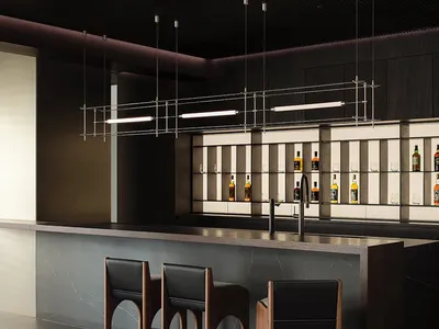 Modern bar with marble countertop, concrete accents, and metal pendant lights.
