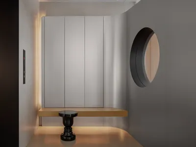 A modern hotel lobby featuring clean lines, curved shapes, and a sleek design.