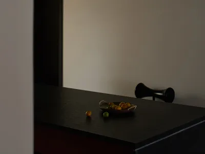 A modern kitchen with stone countertops and minimalist design features.
