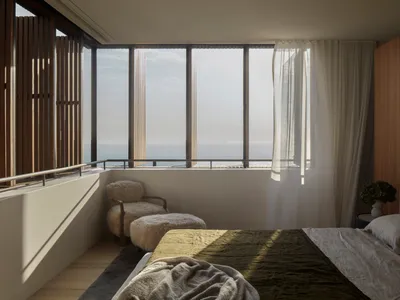 A modern minimalist bedroom with a bed, a chair, a stool, and a curtain.