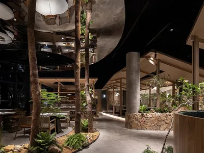 Industrial design restaurant interior with concrete, glass, and wooden elements