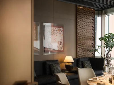 A modern restaurant dining area with fabric seating, glass panels, and metal accents.