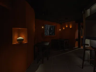 Industrial-style restaurant interior with concrete walls and ambient lighting
