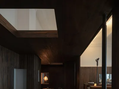 Industrial-style restaurant interior with wooden structures and tables