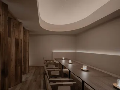 Modern restaurant interior with wooden tables and benches.