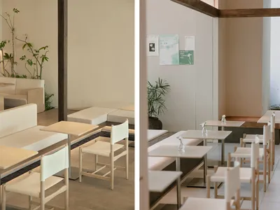 Minimalist restaurant interior with wooden chairs and beige walls