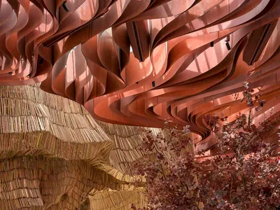 Interior design of a restaurant featuring industrial elements and metallic waves