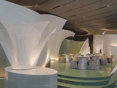 Modern restaurant with concrete walls and illuminated lighting features