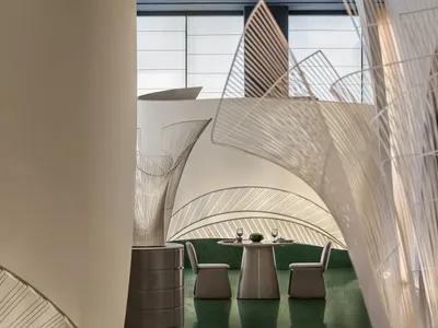 Modern restaurant interior with a tented metal frame design