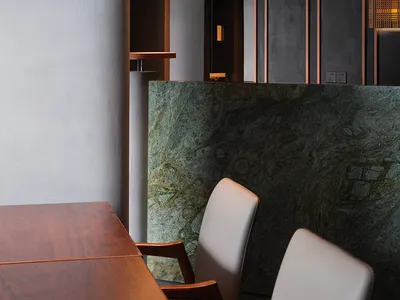 Modern restaurant interior with a combination of marble and wooden elements.
