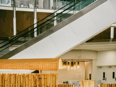 A restaurant interior with bamboo walls and furniture