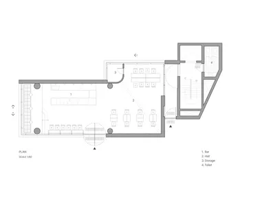 Floor plan of an industrial-style restaurant with concrete and metal finishes.