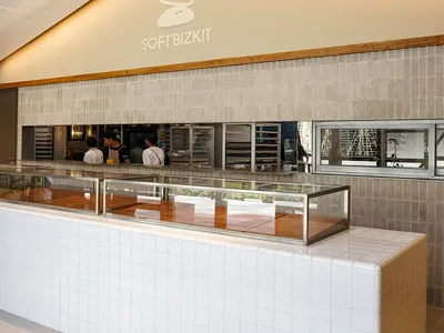 Modern restaurant interior with a tiled and concrete counter