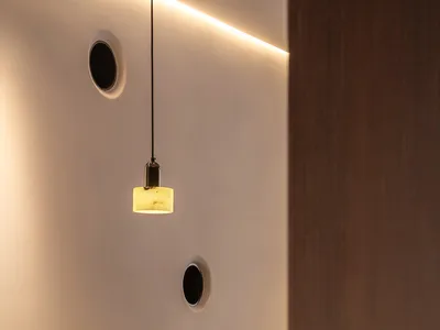 Metallic-walled restaurant interior with minimalist design.
