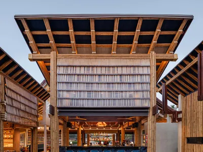 A minimalist restaurant bar with bamboo and glass features.