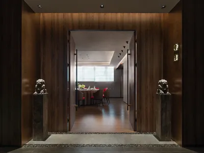 Modern restaurant interior with wooden walls and a dining area.