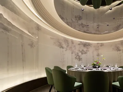 Elegant, modern restaurant interior with paper wall covering, carpet, and green chairs.