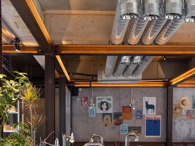 Industrial-style restaurant interior featuring metal and wooden elements